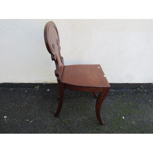 1547 - A Regency mahogany hall chair with scrolled carved back together with small glazed mahogany wall-han... 