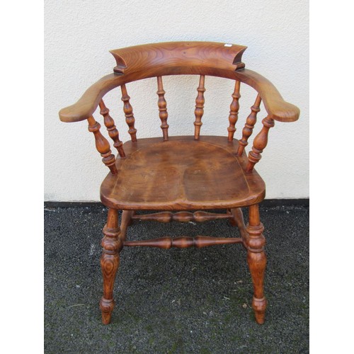 1492 - An elm and ash elbow chair with turned spindles, legs and stretchers.