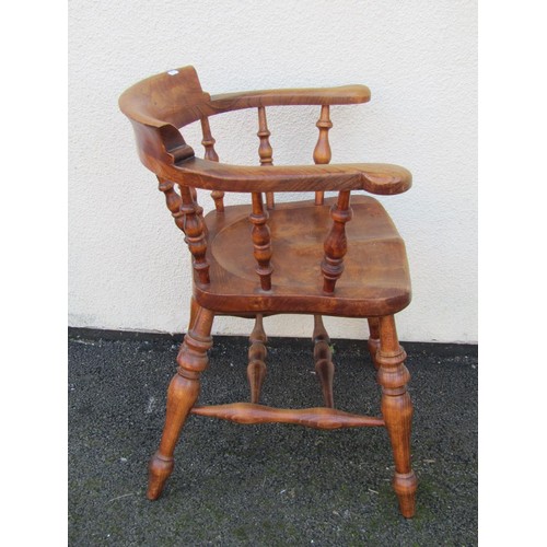 1492 - An elm and ash elbow chair with turned spindles, legs and stretchers.