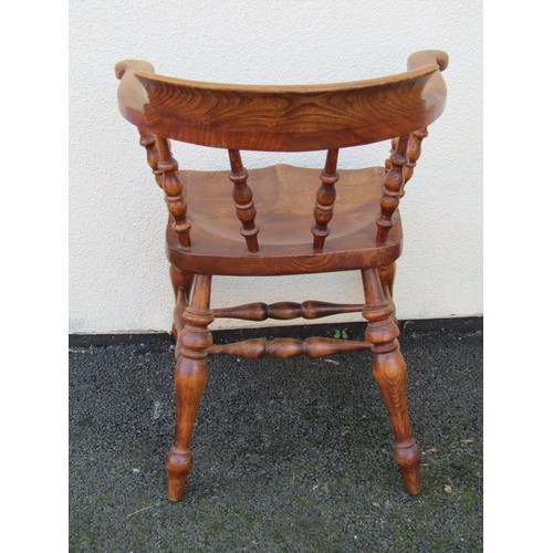 1492 - An elm and ash elbow chair with turned spindles, legs and stretchers.