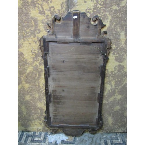 1364 - A Georgian mahogany wall mirror in the Chippendale style with fret carved surround (af) 97cm x 50cm ... 