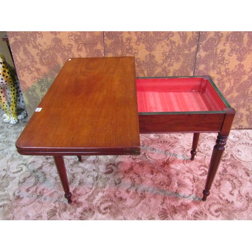 1376 - A Victorian mahogany fold over tea table raised on turned and octagonal tapered supports, 74 cm high... 