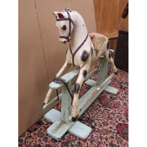 1397 - An Edwardian timber rocking horse in original condition raised on a central bar, 115cm long x 90cm h... 