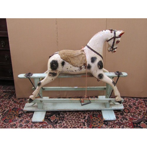 1397 - An Edwardian timber rocking horse in original condition raised on a central bar, 115cm long x 90cm h... 