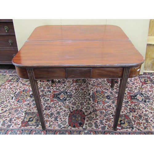 1398 - A Georgian mahogany D-end fold over top tea table, on reeded supports, 98cm wide