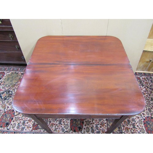 1398 - A Georgian mahogany D-end fold over top tea table, on reeded supports, 98cm wide