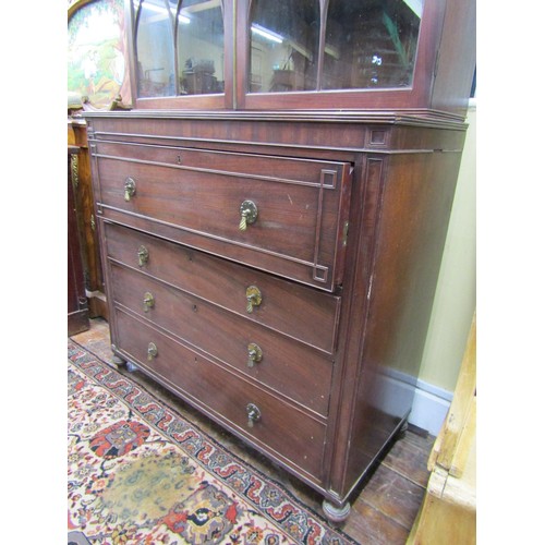 1439 - A Georgian mahogany secretaire bookcase, the lower section enclosed by three long drawers, the secre... 