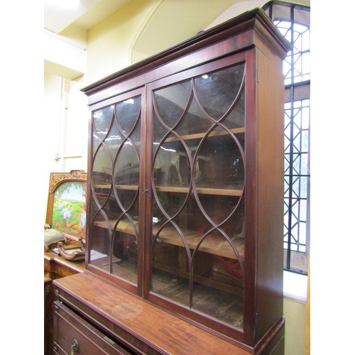 1439 - A Georgian mahogany secretaire bookcase, the lower section enclosed by three long drawers, the secre... 