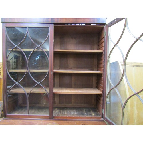 1439 - A Georgian mahogany secretaire bookcase, the lower section enclosed by three long drawers, the secre... 