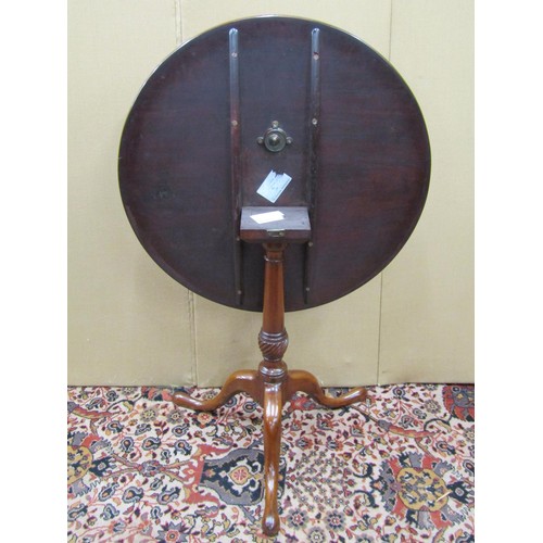 1480 - A Georgian mahogany snap top table, the one piece top 73 cm in diameter, raised on a turned and flut... 