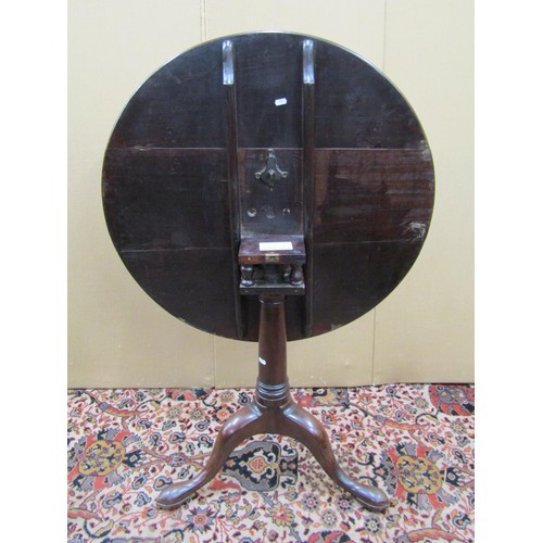 1486 - Georgian mahogany snap top table, the circular top raised on a gun barrel column with bird cage acti... 