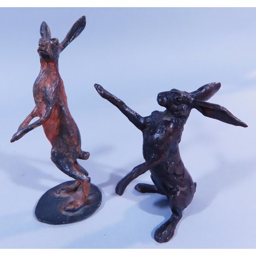 496 - A collection of small limited edition bronze models of hares in boxing poses, one stamped and number... 