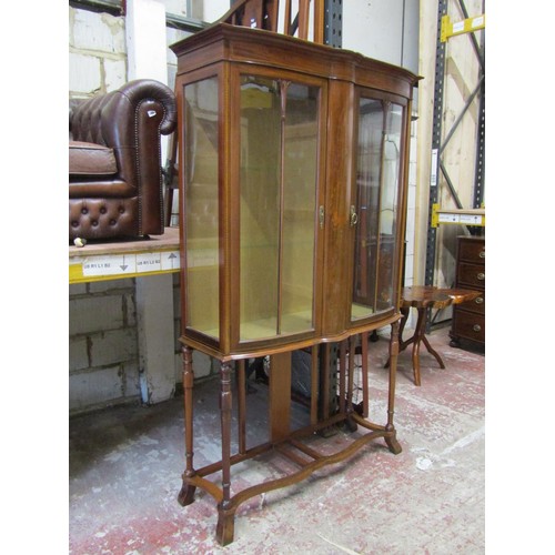 1514 - A tall Edwardian inlaid mahogany display cabinet decorated centrally with lyre and wreath motif, rai... 