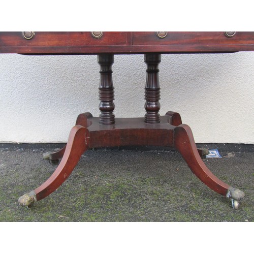 1499 - A 19th century mahogany sofa table fitted with two real and two dummy frieze drawers over a platform... 