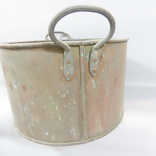 533 - A 19th century copper cistern, three copper kettles, a large saucepan together with a cast iron set ... 