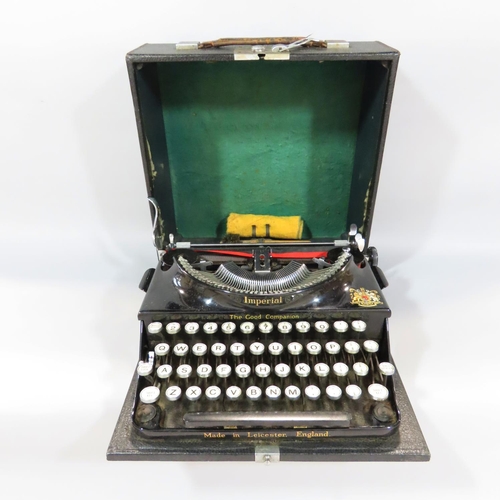 534 - An early 20th century Imperial Typewriter with it's original carry case.