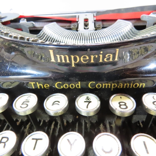 534 - An early 20th century Imperial Typewriter with it's original carry case.