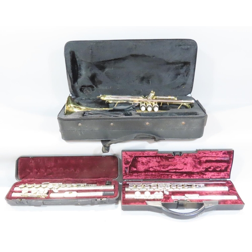 535 - An Elkhart and chrome brass trumpet with case, a Buffet Crampon flute, and an unmarked flute. (3)