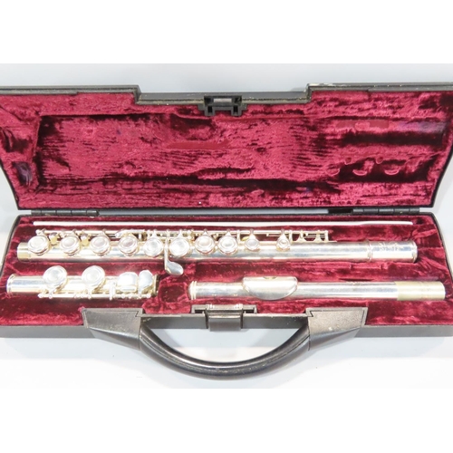 535 - An Elkhart and chrome brass trumpet with case, a Buffet Crampon flute, and an unmarked flute. (3)