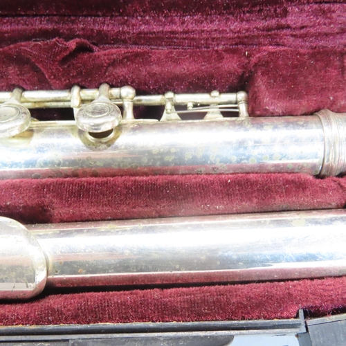 535 - An Elkhart and chrome brass trumpet with case, a Buffet Crampon flute, and an unmarked flute. (3)