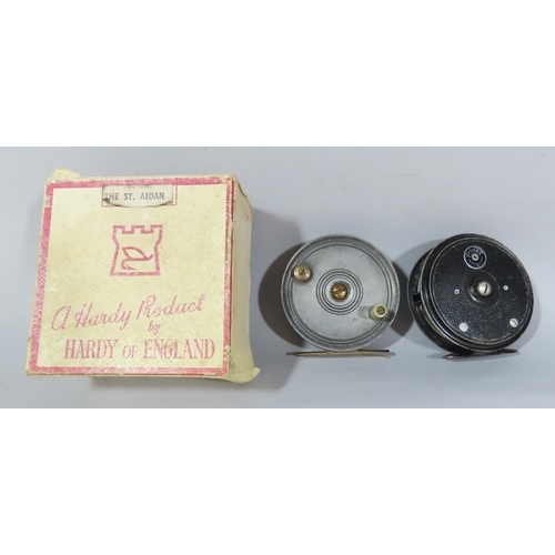 541 - A Hardy St Aidan fishing reel in it's original box,  and two further vintage fly fishing reels (3)