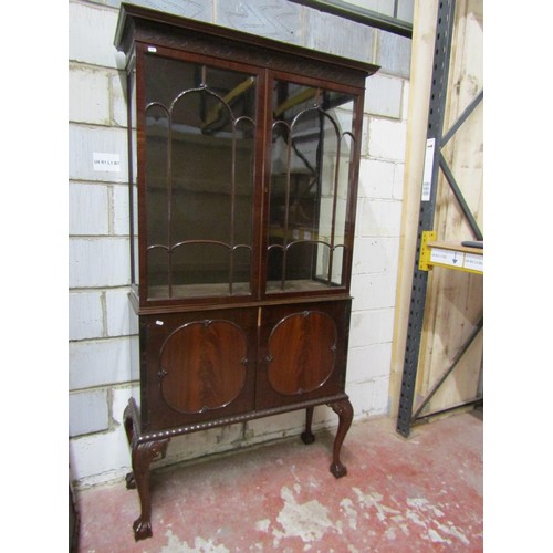 1501 - A good quality 19th century glazed mahogany bookcase, the arched panelled doors over a pair of panel... 