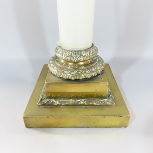 473 - An opaque white glass column candlestick with a stepped brass square base and brass sconce, adapted ... 