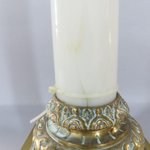 473 - An opaque white glass column candlestick with a stepped brass square base and brass sconce, adapted ... 