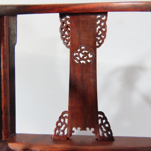 481 - A 20th century Chinese boxed carved hardwood group, miniature pair of horseshoe backed chairs,  asso... 