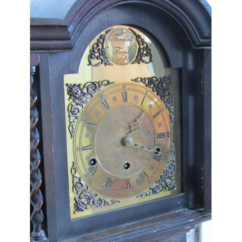 1563 - An Edwardian grandmother clock with broken arch dial and three train striking movement, the engraved... 