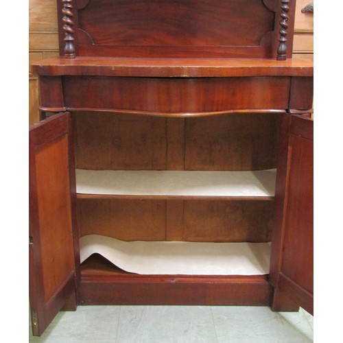 1573 - A small Victorian mahogany chiffonier with serpentine outline on barley twist supports