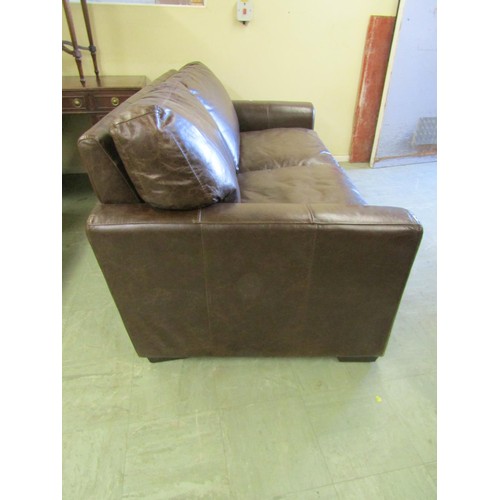 1579 - A good quality contemporary stitched brown leather two-seater sofa bed, 200cm wide.