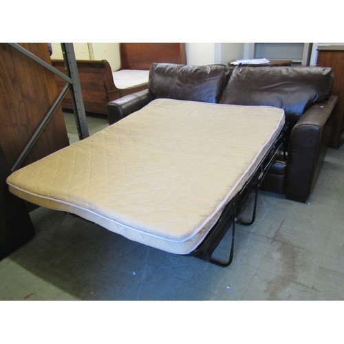 1579 - A good quality contemporary stitched brown leather two-seater sofa bed, 200cm wide.