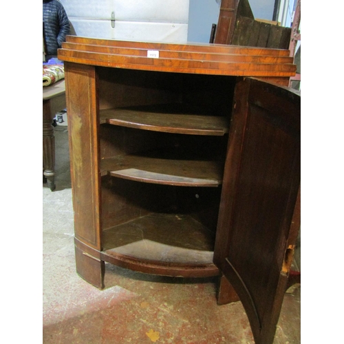 1584 - An early 19th century mahogany free standing corner cupboard with inlaid panelled door, 115cm high x... 