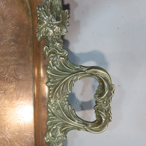 566 - A copper tray with silver plated grape vine edging and a pair of candlesticks similar, together with... 