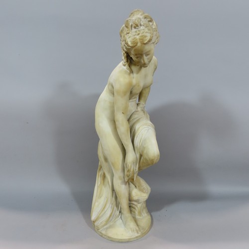 569 - A sculpture after Joseph Frugoni of Venus Bathing, detached from its circular base, 59cm high.