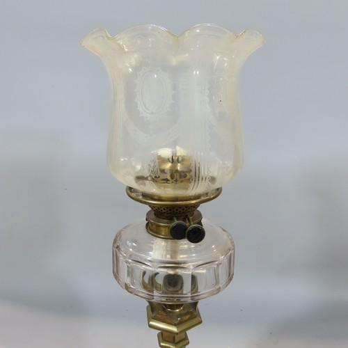 570 - A Gothic Victorian brass candlestick Hinks oil lamp with an etched glass shade, 75cm high.