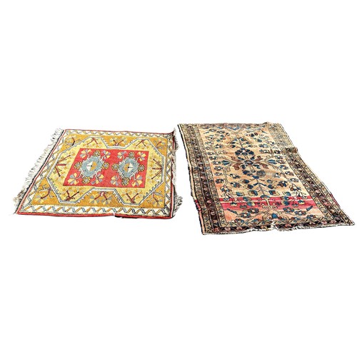 6022 - A Kazak type rug with a central pink panel , 110cm x 105cm and another Persian carpet with a floral ... 