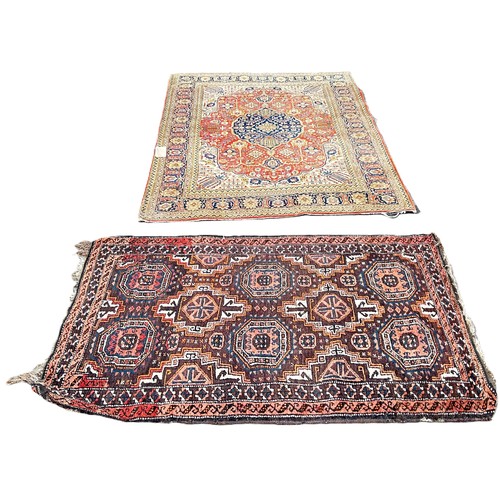 6039 - A Persian style carpet with a central medallion with a floral ground, 196cm x 130m together with a s... 