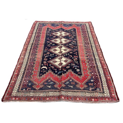 1624 - A Northeast Persian Sumak Kilim, with four interlocking diamonds on a blue ground interspersed with ... 