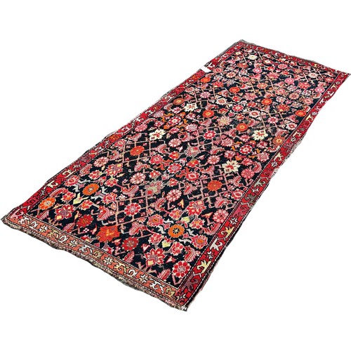 1652 - A Tree of Life Middle Eastern type carpet with floral sprays on a pink ground together with an old M... 