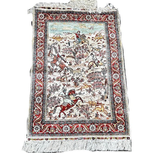 1654 - A Persian silk rug with  a hunting scene possibly Isfahan 92cm x 65cm