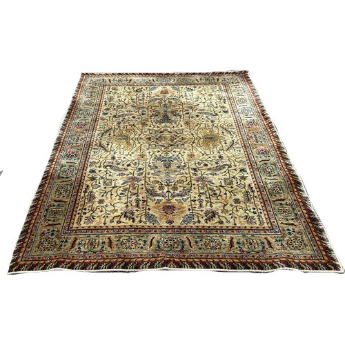 1648 - A Middle Eastern Ziegler type carpet with an all over floral design on a pale green ground, 230cm x ... 