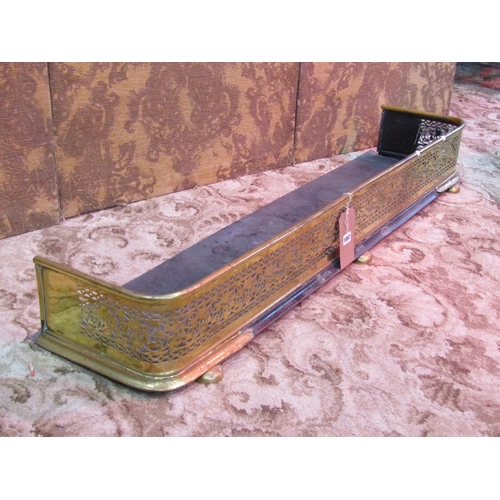 1067 - A polished brass fire fender with decorative pierced fretwork grill, 18 cm high x 130 cm together wi... 