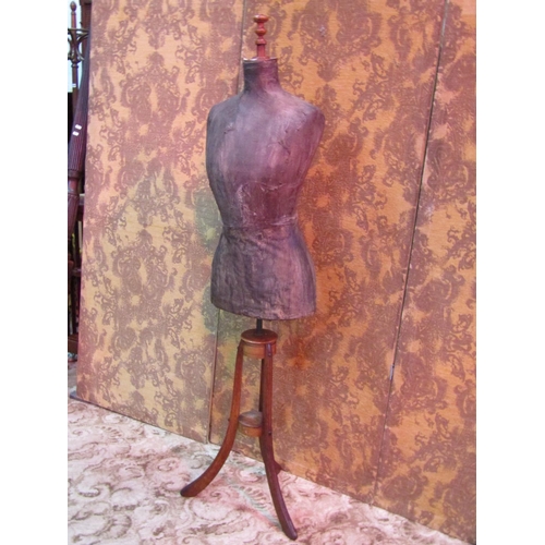 1127 - A Victorian tailors dummy (female torso) raised on swept oak and walnut supports