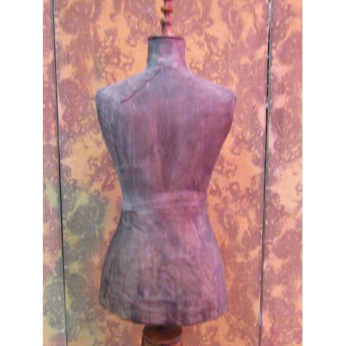 1127 - A Victorian tailors dummy (female torso) raised on swept oak and walnut supports