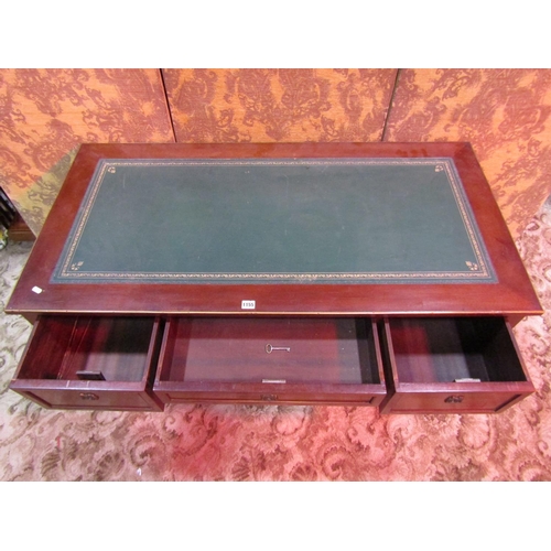 1155 - An antique French mahogany kneehole writing table/desk with inset tulled green leather top over an a... 