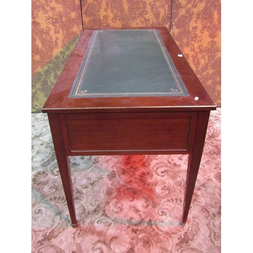 1155 - An antique French mahogany kneehole writing table/desk with inset tulled green leather top over an a... 