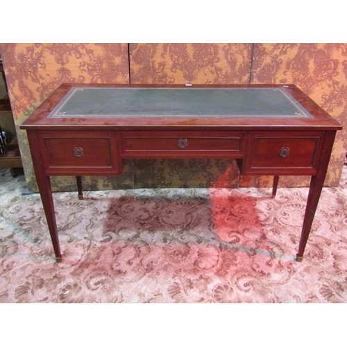 1155 - An antique French mahogany kneehole writing table/desk with inset tulled green leather top over an a... 