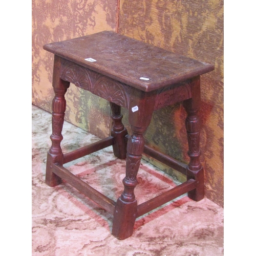 1210 - A good quality old English style oak joint stool with carved detail and turned baluster supports, un... 